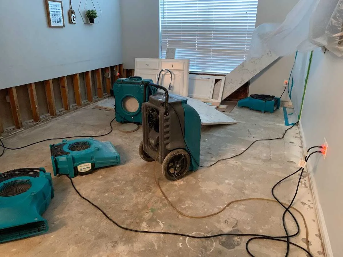 Dehumidifier in flood-cut room for Water Damage Restoration in Chanhassen